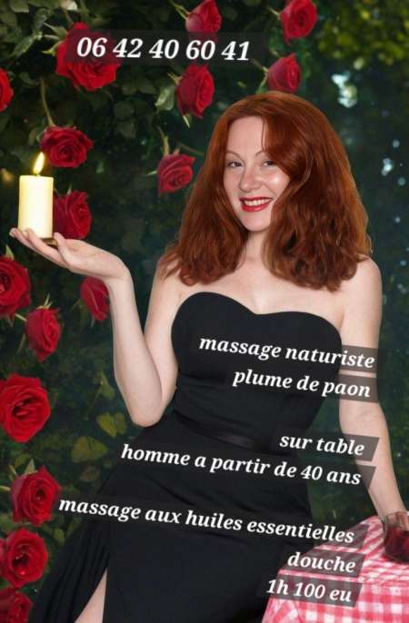 Photo de  Massage naturiste a la plume de paon sur table.